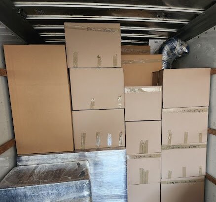 Boxes packed and loaded neatly on back of moving company Dallas